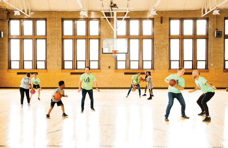 30 in Their Thirties honorees play basketball with The Family's basketball camp participants