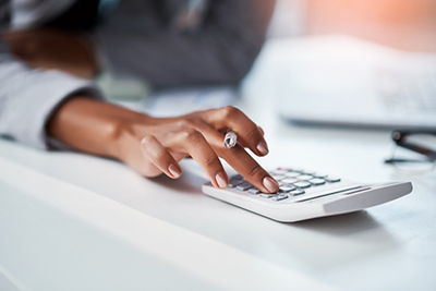 woman using calculator