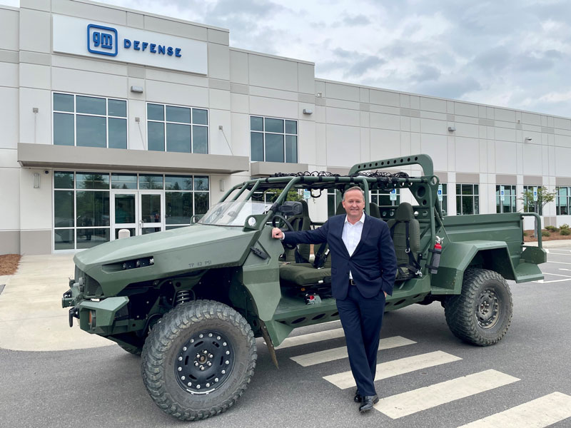 Steve duMont with GM Defense vehicle