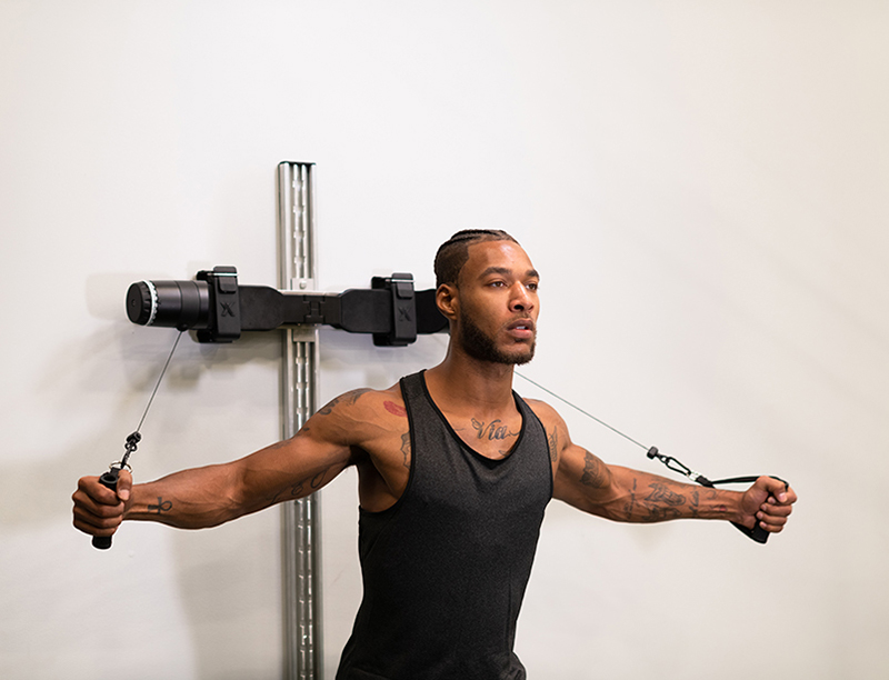 A man uses the MAXPRO system for a chest exercise.