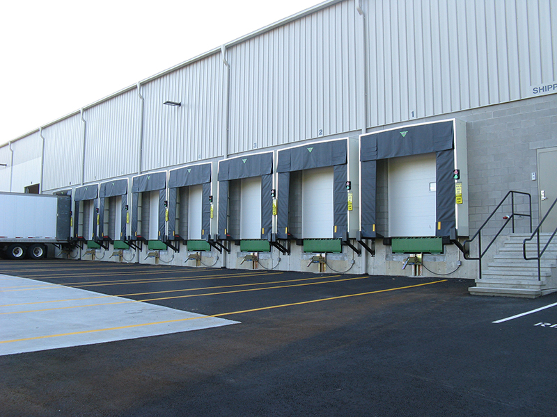 A shipping bay with Baron Industries hanging doors