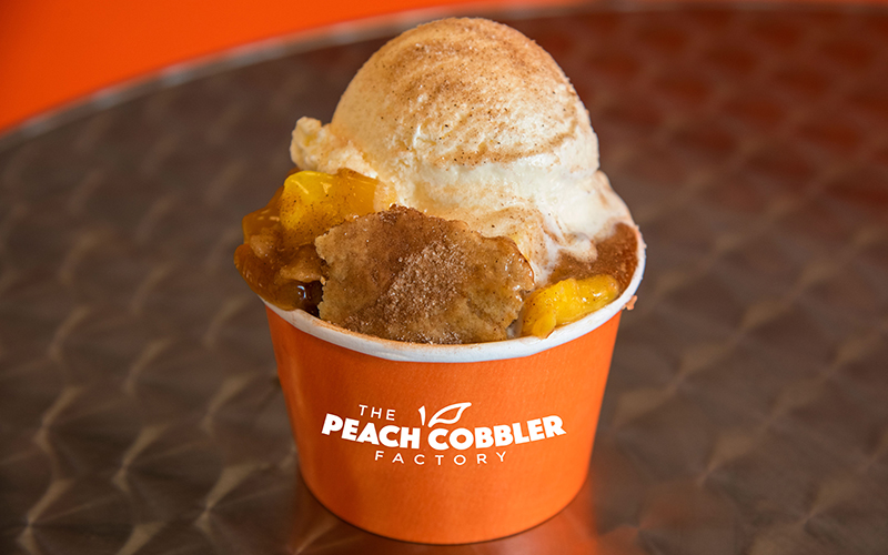The Peach Cobbler Factory will be serving up cobbler, cinnamon rolls, and more at eight new franchise locations in metro Detroit. // Courtesy of The Peach Cobbler Factory