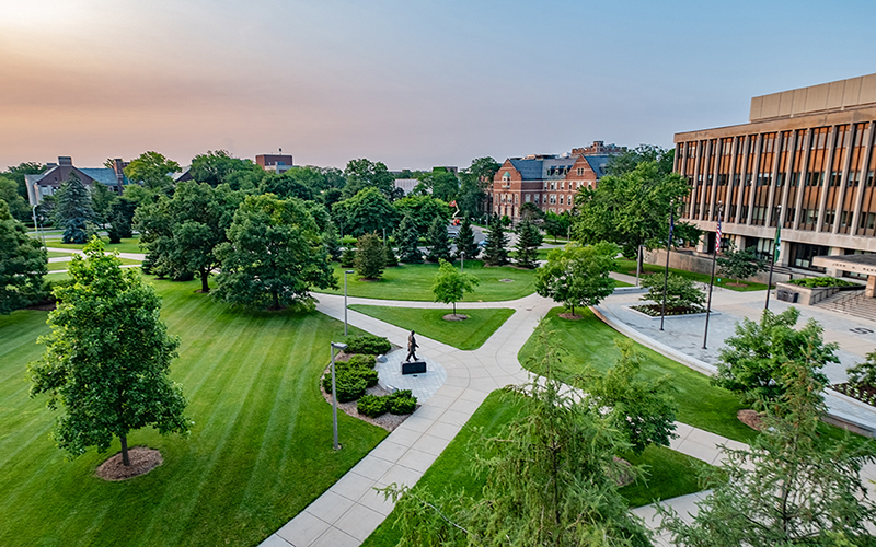 Sunrise over Agriculture Hall, Auditorium Road and Hannah Plaza