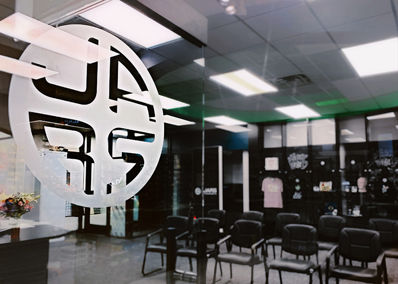 interior photo of cannabis dispensary with chairs and a JARS logo